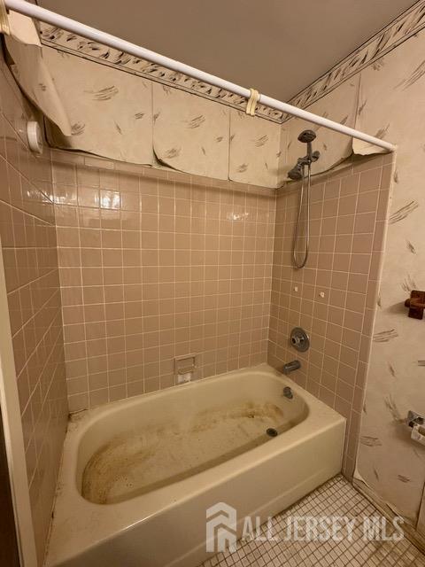 165 Penn Ct, Old Bridge, NJ 07747 - full bathroom with shower / bath combo with shower curtain, tile patterned floors, and wallpapered walls