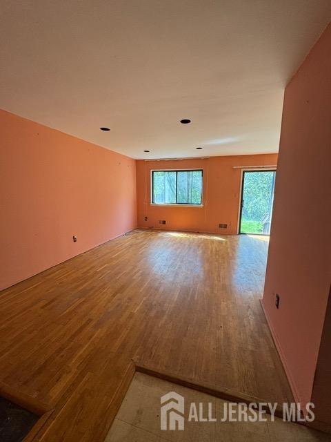 165 Penn Ct, Old Bridge, NJ 07747 - empty room with wood finished floors