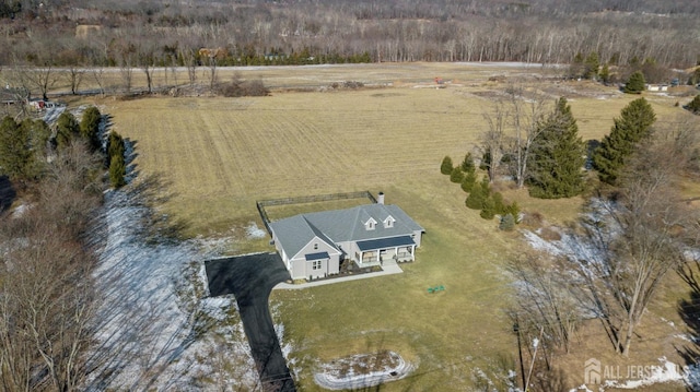 birds eye view of property featuring a rural view