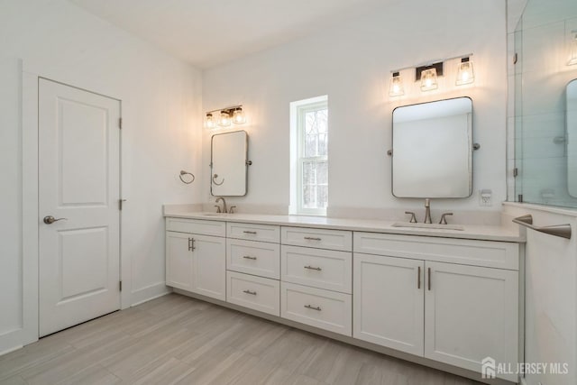 bathroom featuring vanity and wood-type flooring