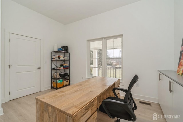 home office with light wood-type flooring