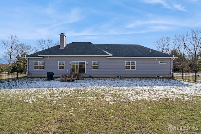 rear view of house with a yard