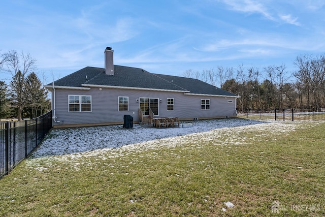 back of house featuring a yard