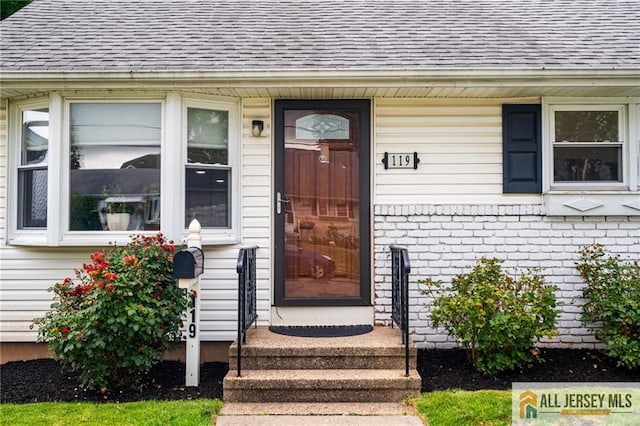 119 Brown Ave, Iselin, NJ 08830 - property entrance with roof with shingles and brick siding