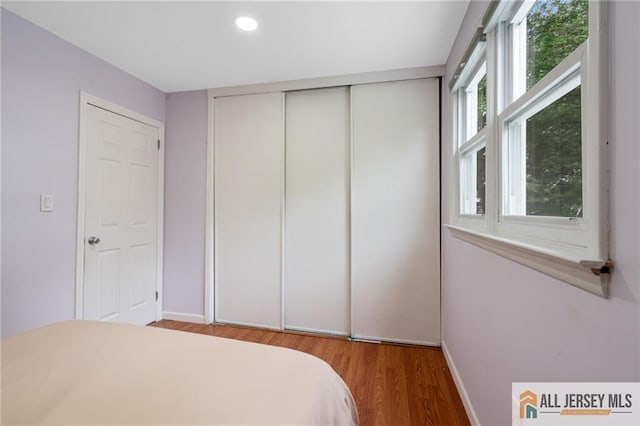 119 Brown Ave, Iselin, NJ 08830 - bedroom with wood finished floors, a closet, and recessed lighting