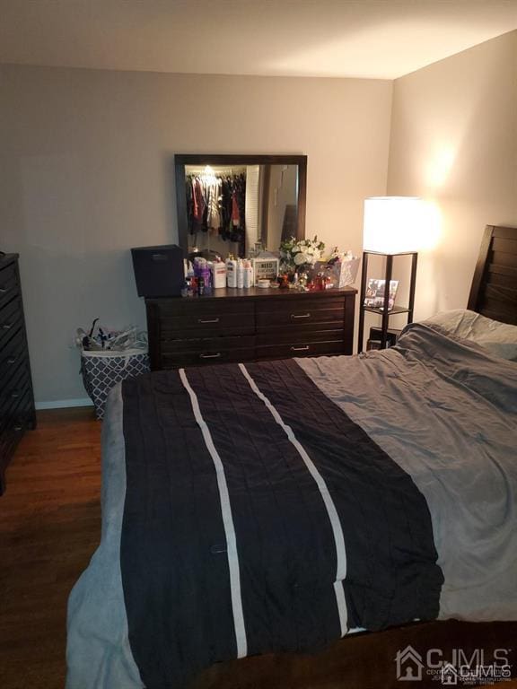 18 Judson St Unit 3A, Edison, NJ 08837 - bedroom with dark wood-style flooring and baseboards