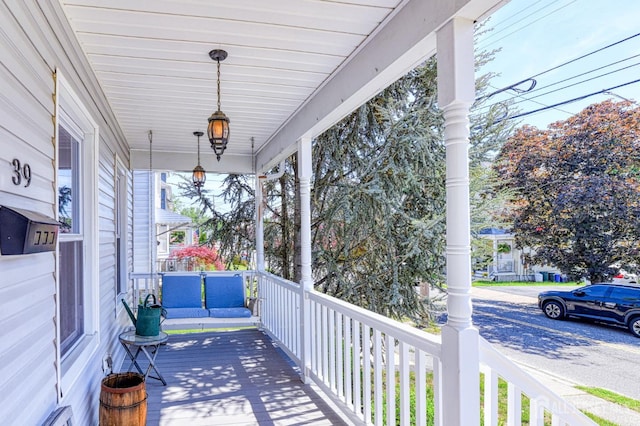 wooden terrace with a porch