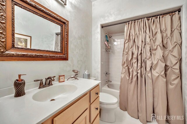 full bathroom featuring toilet, shower / tub combo, vanity, and tile patterned flooring