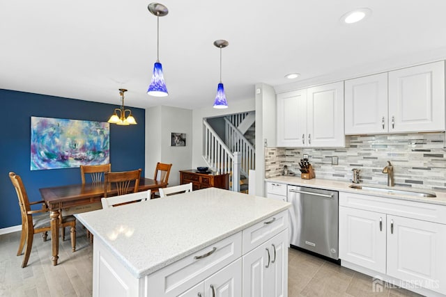 675 Bound Brook Rd Unit C0019, Dunellen, NJ 08812 - kitchen with stainless steel dishwasher, decorative backsplash, decorative light fixtures, white cabinets, and recessed lighting