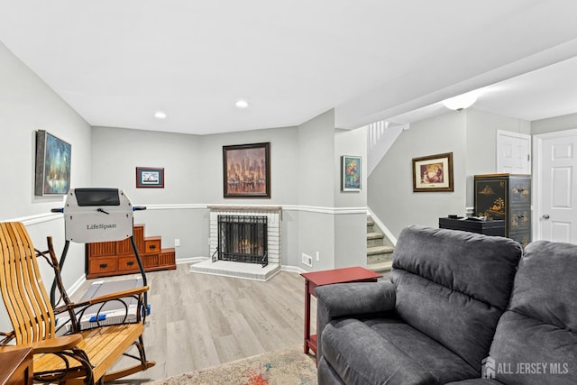 675 Bound Brook Rd Unit C0019, Dunellen, NJ 08812 - living area with light wood finished floors, stairway, a brick fireplace, and recessed lighting