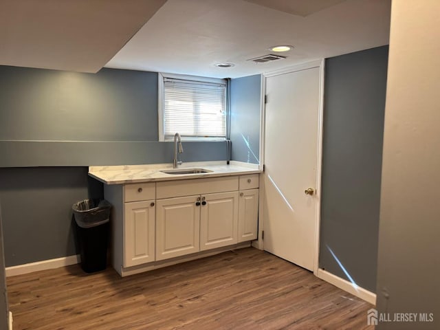 220 S Washington Ave, Dunellen, NJ 08812 - bar area featuring a sink and wood finished floors