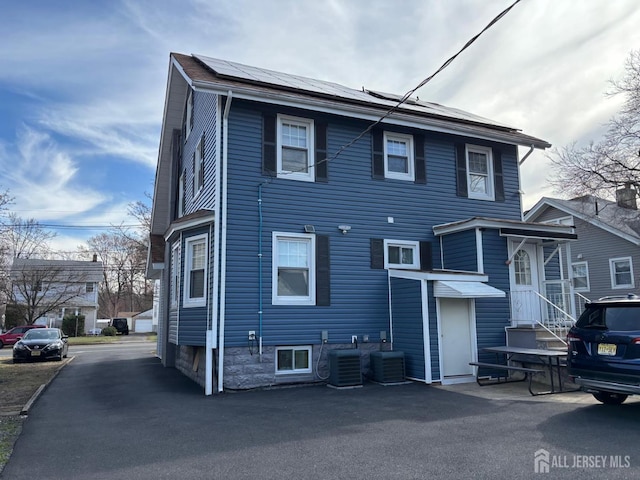 220 S Washington Ave, Dunellen, NJ 08812 - back of house featuring solar panels