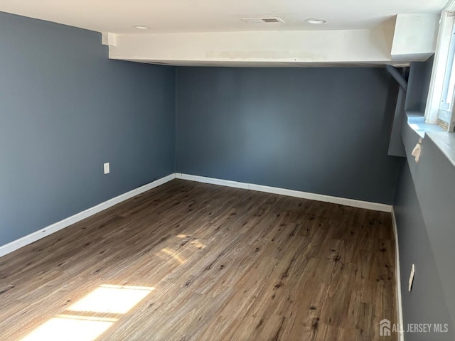 220 S Washington Ave, Dunellen, NJ 08812 - additional living space featuring wood finished floors and baseboards