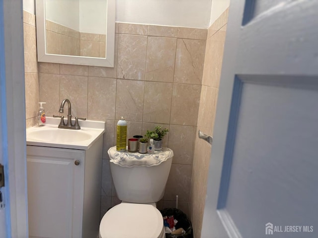 220 S Washington Ave, Dunellen, NJ 08812 - bathroom featuring tile walls and vanity