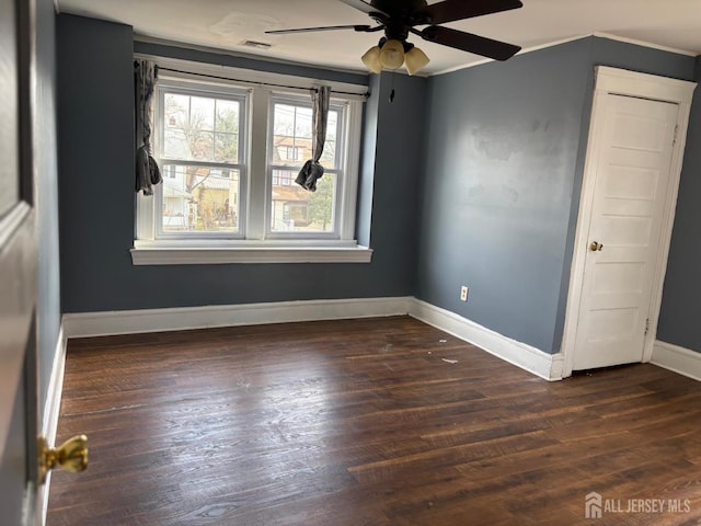 220 S Washington Ave, Dunellen, NJ 08812 - empty room featuring a ceiling fan, dark wood finished floors, and crown molding
