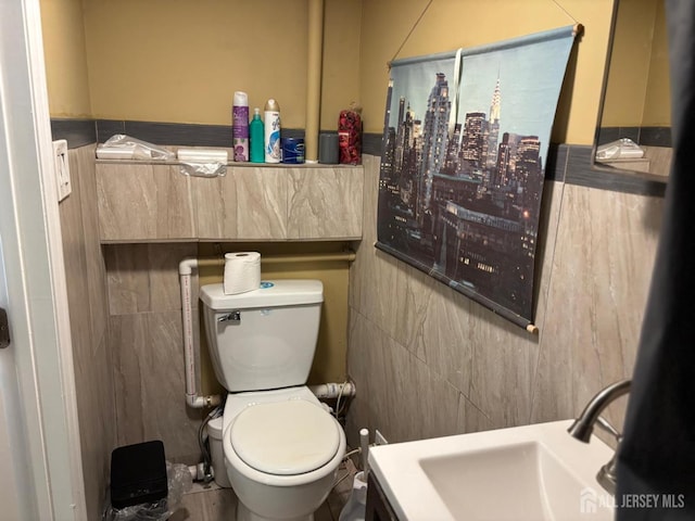 220 S Washington Ave, Dunellen, NJ 08812 - bathroom with tile walls and toilet