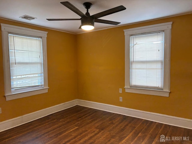 220 S Washington Ave, Dunellen, NJ 08812 - spare room with dark wood-style flooring, a ceiling fan, and ornamental molding