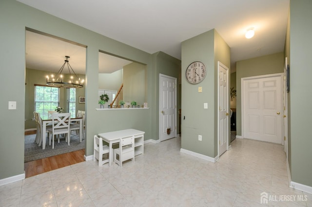 274 Pinelli Dr, Piscataway, NJ 08854 - hall featuring a chandelier and stairs