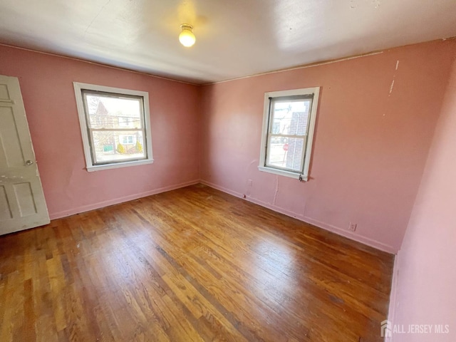 170 Rutgers St, New Brunswick, NJ 08901 - spare room featuring wood finished floors and baseboards