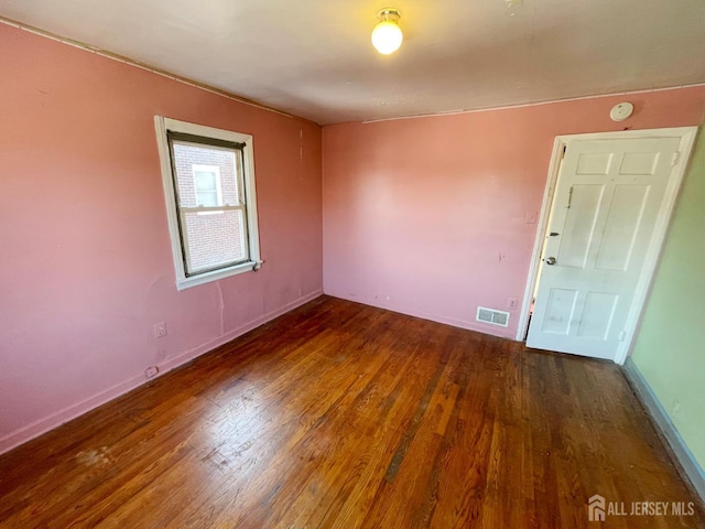 170 Rutgers St, New Brunswick, NJ 08901 - spare room featuring wood finished floors, baseboards, and a smoke detector