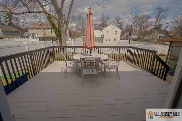182 Columbia Ave, North Plainfield, NJ 07060 - deck with a fenced backyard, outdoor dining space, and a residential view