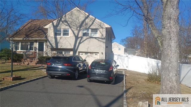 182 Columbia Ave, North Plainfield, NJ 07060 - tri-level home with asphalt driveway and an attached garage