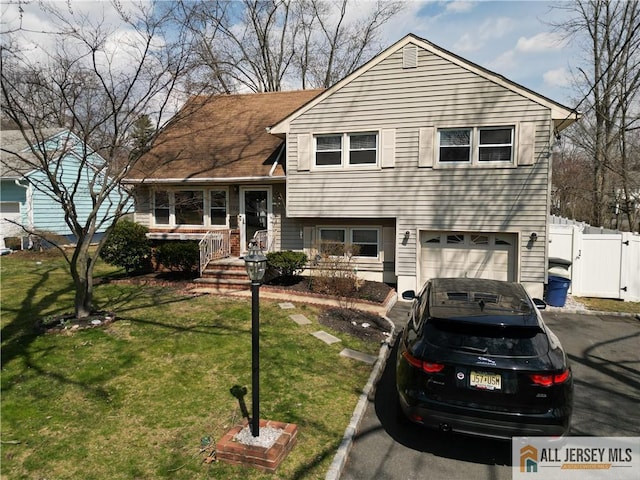 182 Columbia Ave, North Plainfield, NJ 07060 - split level home featuring a garage and asphalt driveway