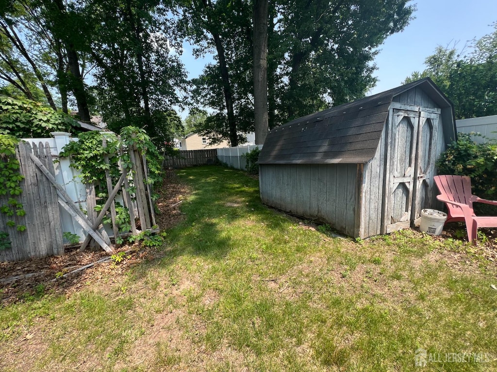 35 Orchard St, Metuchen, NJ 08840 - fenced backyard with a storage shed