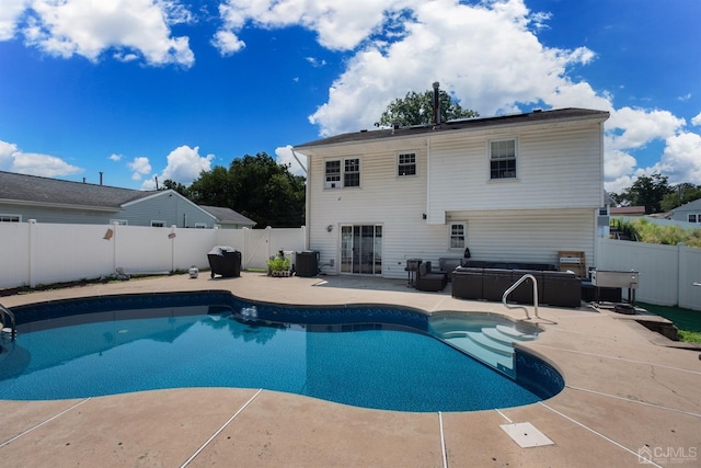 view of pool featuring cooling unit and a patio area