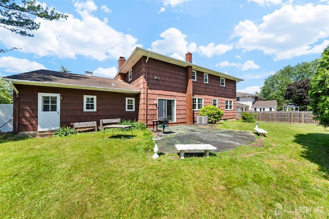 85 Hidden Lake Dr, North Brunswick, NJ 08902 - rear view of property featuring a chimney and a patio
