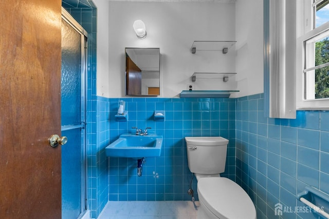 85 Hidden Lake Dr, North Brunswick, NJ 08902 - bathroom with tile walls, a shower stall, and a wainscoted wall