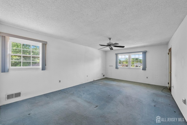 85 Hidden Lake Dr, North Brunswick, NJ 08902 - carpeted spare room featuring a textured ceiling and a ceiling fan