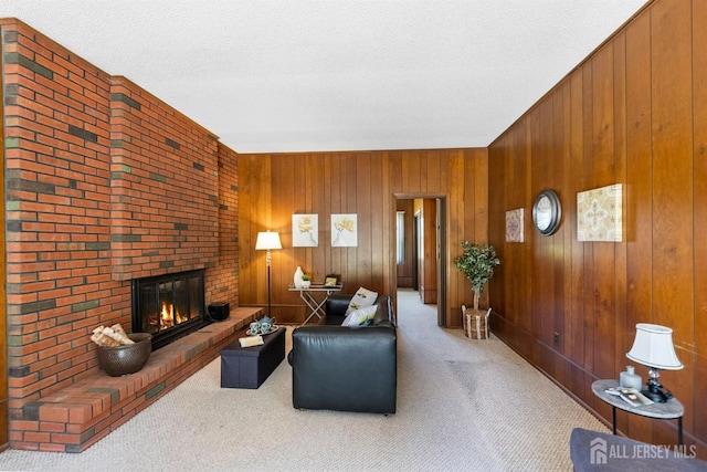 85 Hidden Lake Dr, North Brunswick, NJ 08902 - living room featuring carpet floors, a fireplace, wooden walls, and a textured ceiling