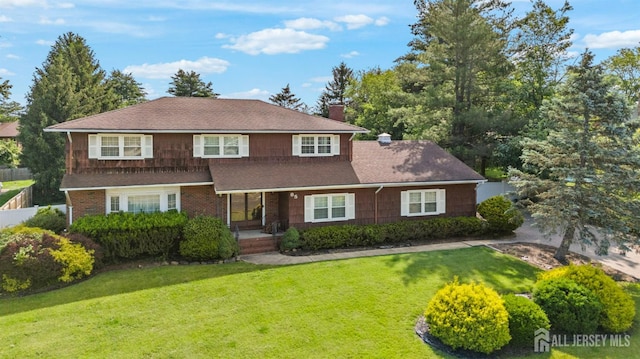 85 Hidden Lake Dr, North Brunswick, NJ 08902 - traditional-style home with a chimney, a shingled roof, and a porch