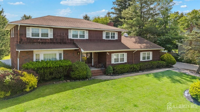 85 Hidden Lake Dr, North Brunswick, NJ 08902 - traditional-style house featuring a chimney, a porch, a front lawn, and a shingled roof