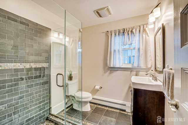 full bathroom with baseboard heating, toilet, a shower stall, vanity, and baseboards