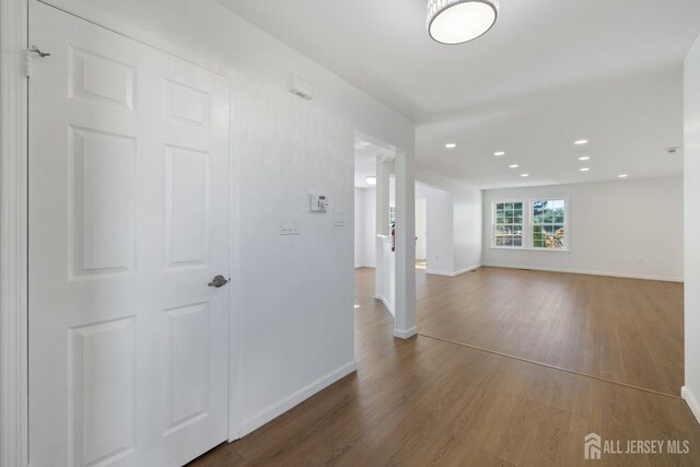 spare room with wood-type flooring