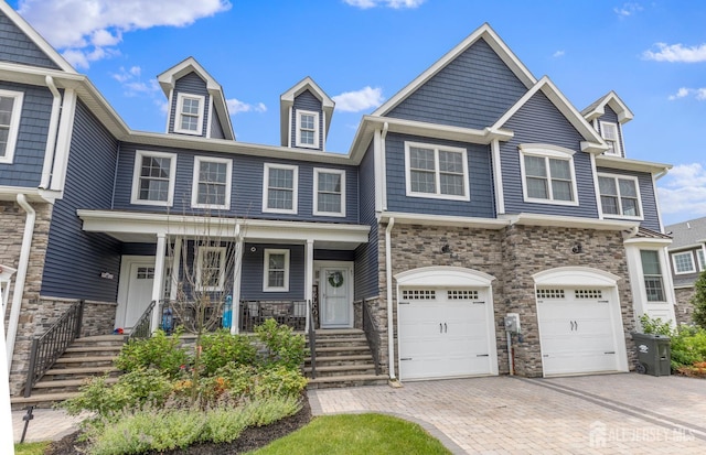 85 Valentino Dr, Old Bridge, NJ 08875 - multi unit property with stone siding, decorative driveway, a porch, and an attached garage