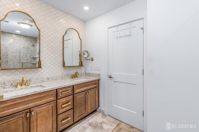 85 Valentino Dr, Old Bridge, NJ 08875 - full bathroom with double vanity, a tile shower, and tasteful backsplash