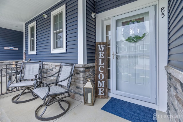 85 Valentino Dr, Old Bridge, NJ 08875 - doorway to property featuring a porch and a surveillance system