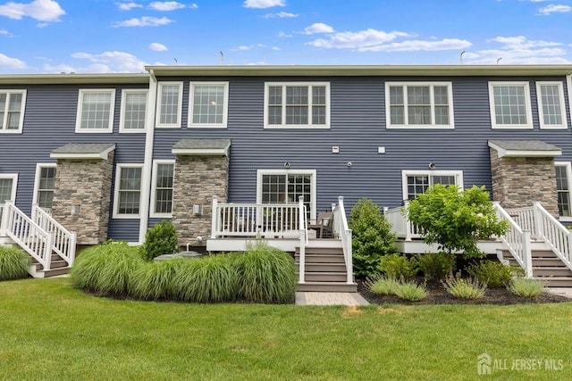 85 Valentino Dr, Old Bridge, NJ 08875 - back of property featuring stairway, a lawn, and a wooden deck