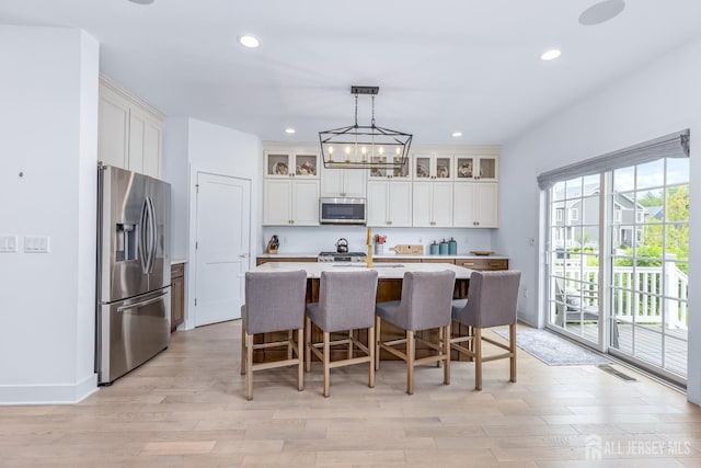 85 Valentino Dr, Old Bridge, NJ 08875 - kitchen featuring appliances with stainless steel finishes, recessed lighting, a chandelier, light countertops, and white cabinetry