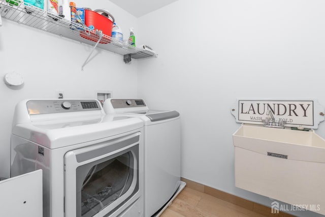 85 Valentino Dr, Old Bridge, NJ 08875 - laundry room with washing machine and clothes dryer and light wood-type flooring