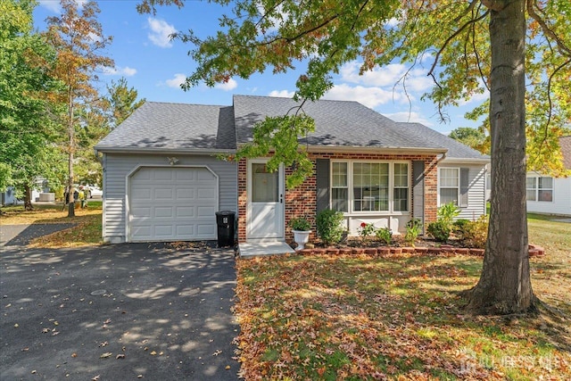 single story home featuring a garage