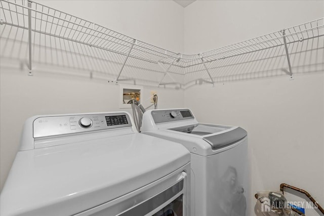 washroom with separate washer and dryer