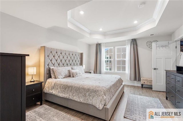 1604 English Ln, Sayreville, NJ 08859 - bedroom featuring a tray ceiling, light wood-type flooring, crown molding, and recessed lighting