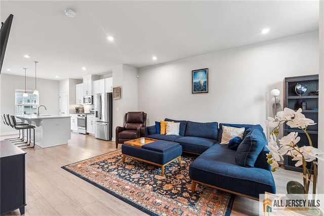 1604 English Ln, Sayreville, NJ 08859 - living room with light wood-style floors and recessed lighting