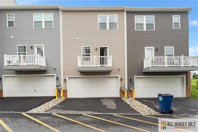 1604 English Ln, Sayreville, NJ 08859 - rear view of house with brick siding and an attached garage