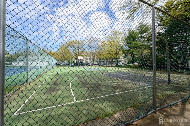 view of tennis court with basketball court