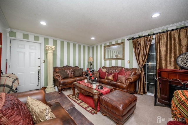 carpeted living room featuring ornate columns, a textured ceiling, and ornamental molding